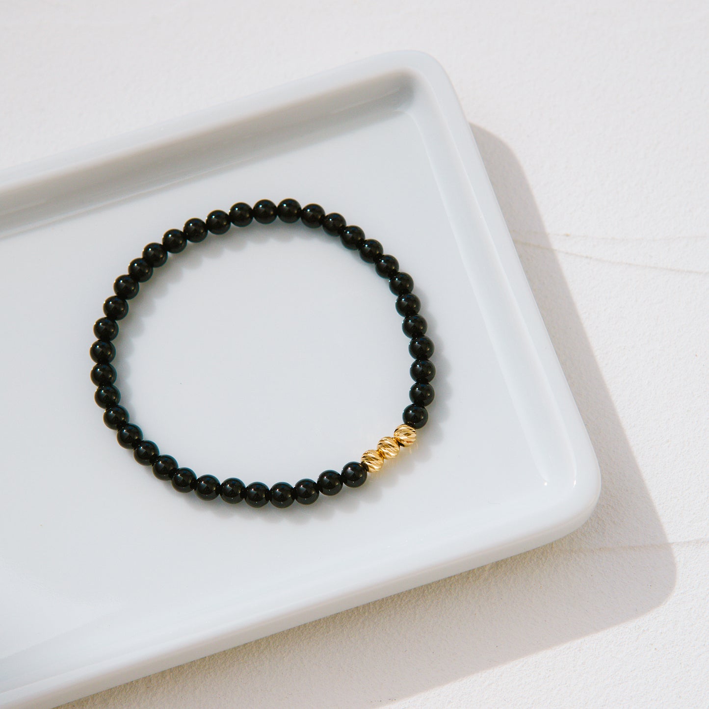 18K Gold Cut Bead and Onyx Bracelet